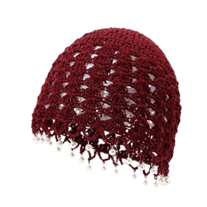 Deep red hand-woven crochet beanie with hollow patterns and pearl bead trimmings