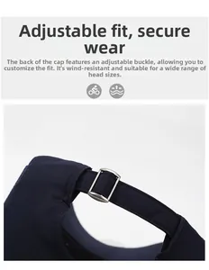 Detail of adjustable metal buckle on navy baseball cap for custom fit and wind resistance