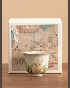 Close-up of Ru Kiln rabbit tea cup with celadon crackle glaze and elegant gift box