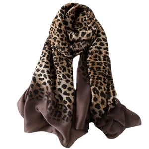 Elegant leopard print silk-feel scarf with deep brown border for women, draped style