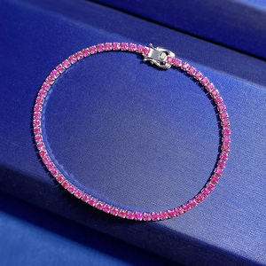 Single row S925 sterling silver tennis bracelet with round pink zircon stones on a blue box