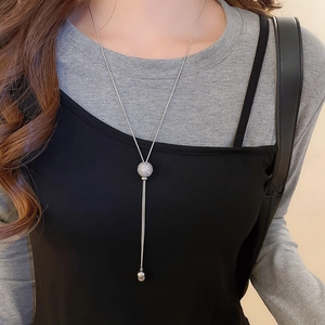 Silver geometric spherical pendant necklace with sparkling zircon and long tassel detail