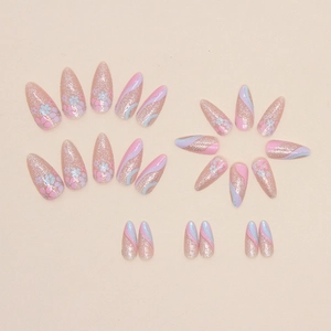 Sparkly almond press-on nails with silver glitter floral and blue wavy line patterns