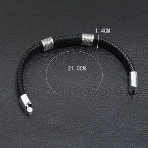 Detail shot of black braided leather bracelet with silver buckle and size measurements