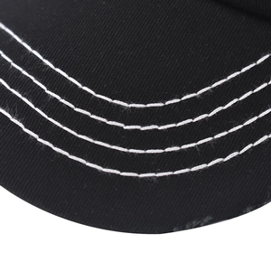 Detail of washed cotton baseball cap brim with triple white contrast stitching