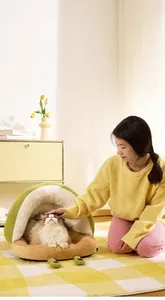 Snail-shaped semi-enclosed warm cat bed with soft plush fabric in avocado green