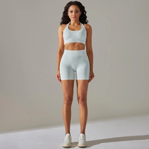 Detail of light blue seamless yoga set showing ribbed high waist and knit texture