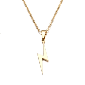 Detailed view of a minimalist golden lightning bolt pendant on a fine link chain necklace