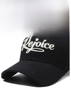 Close-up of white 3D embroidery on black cotton baseball cap showing Rejoice lettering