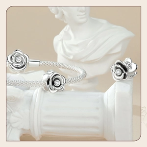 Artistic display of S925 sterling silver rose jewelry set on classical statues