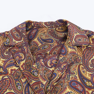 Close-up detail of paisley printed collar and twill fabric texture on a women's shirt