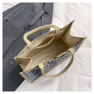 Top view of large leopard print tote bag interior showing the zipper pocket and linen lining