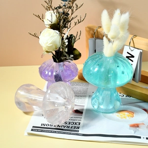 Detailed view of mushroom-shaped resin vases with glitter finish and texture in cozy setting