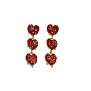 Vintage red enamel heart earrings with golden rose patterns in French retro style