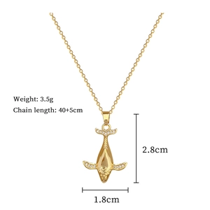 Macro view of gold whale pendant with dimensions 2.8cm by 1.8cm on a 40cm chain