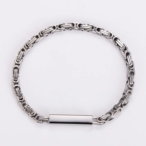Macro shot of silver Byzantine chain bracelet with polished stainless steel magnetic clasp