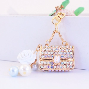 Sparkling crystal handbag keychain with white camellia flower and pearl charms