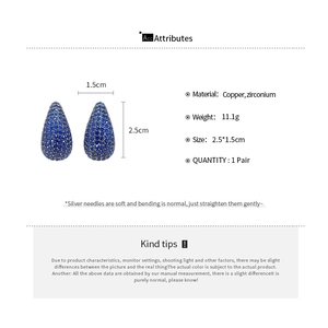 Detail view of blue teardrop stud earrings with size measurements and copper base info