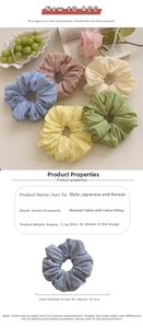 Floral satin scrunchie detail showing 15.5cm diameter and lightweight fabric material
