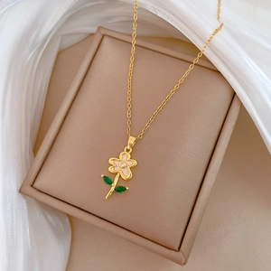 Luxurious gold stainless steel flower necklace with shell petals and green leaf accents