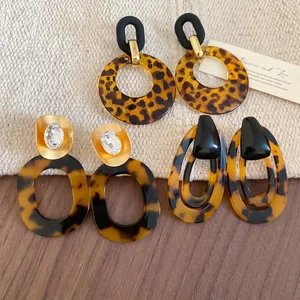 Retro acrylic leopard print earrings with gold brushed metal and resin details