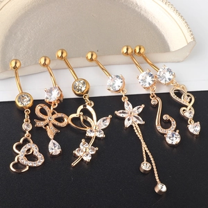Detail of 6pcs gold-plated belly rings set with diverse cubic zirconia pendant designs