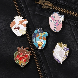 Artistic oil painting heart pins attached to a black leather jacket pocket detail
