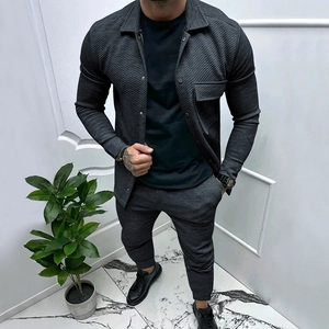 Detail of dark grey textured twill fabric on men's casual two-piece jacket and pants set