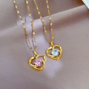 Elegant gold titanium heart necklaces with pink and white micro-paved crystals