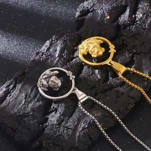 Detail of panda and butterfly charms on hollow round titanium steel necklaces