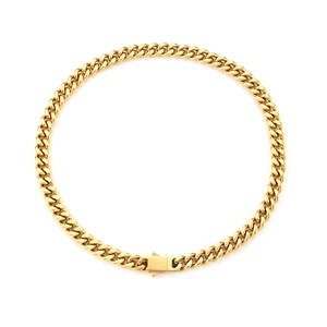 Golden Cuban link chain necklace in stainless steel with lobster clasp on white background