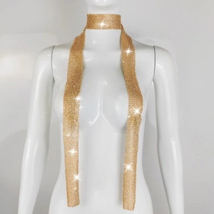 Detail of a sparkling gold sequin metal mesh scarf necklace on a mannequin