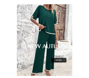 Detail of dark green knit set showing contrast trim on sleeves and wide leg pants
