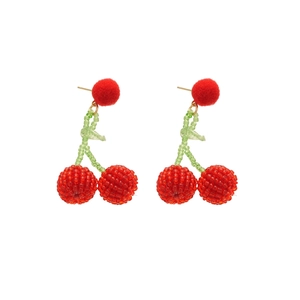 Cute red cherry beaded dangle earrings with soft pompom accent on white background