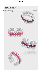 Macro shot of S925 sterling silver beaded rings with pink and purple enamel details