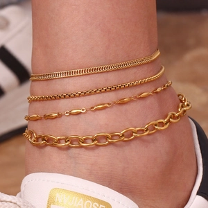 Close-up of 18K gold plated stainless steel anklet set featuring layered chain designs