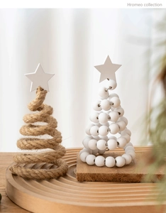 Detail of Nordic wooden Christmas tree set with hemp rope and white beads on a tray