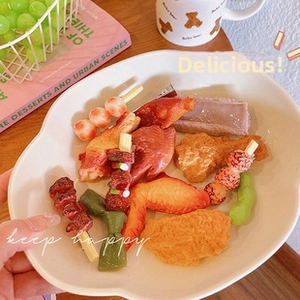 Detailed close-up of realistic miniature food hair clips set with glossy resin texture