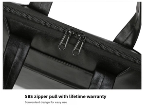 Close-up of durable SBS metal dual zippers on black lychee grain leather laptop bag