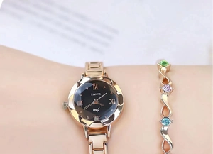 Close-up of rose gold watch and gemstone bracelet set on a woman's wrist with jewelry detail