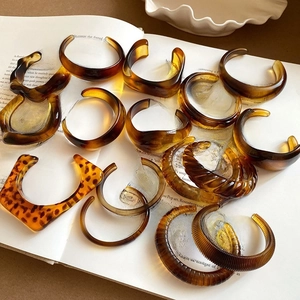 French vintage amber resin open bracelets set with leopard pattern on open book