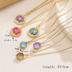 Detailed view of colorful butterfly and oval pendants with weight and size specifications