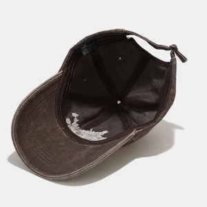 Vintage washed cotton baseball cap featuring 6-panel structure and adjustable strap