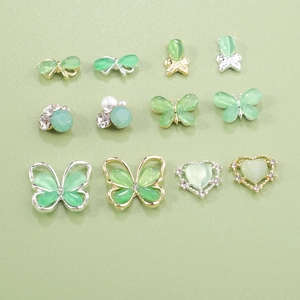 Cat eye stone butterfly nail art charms set in mint green and gold alloy finish