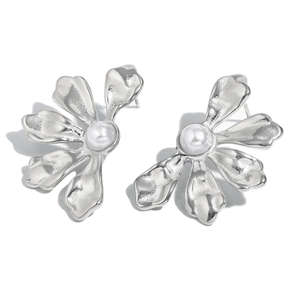 Elegant silver flower earrings with white pearl center in a minimalist artistic style