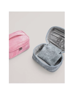 Detail of travel toiletry bag with interior brush slots and transparent pockets