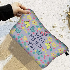 Floral butterfly lavender makeup bag with zipper and Love is in the air text held by hand