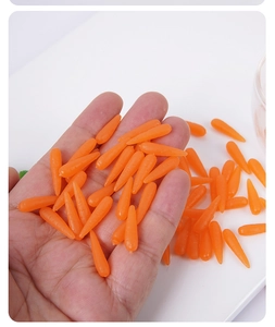 Close-up of 1.8cm mini resin carrots for dollhouse miniature scenes and DIY crafts
