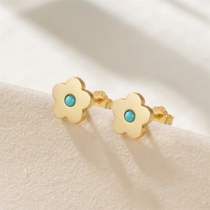 Macro view of S925 sterling silver flower stud earrings with turquoise center stone