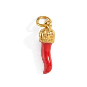 Macro view of red cornicello charm with gold crown top and polished enamel finish